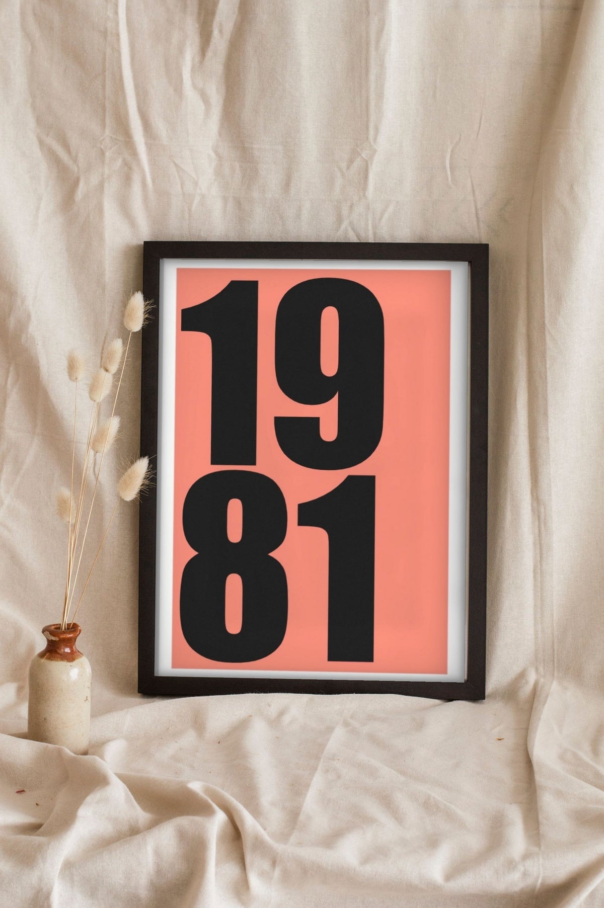 Lifestyle - Personalised Date Print leaning in a frame with dried flowers