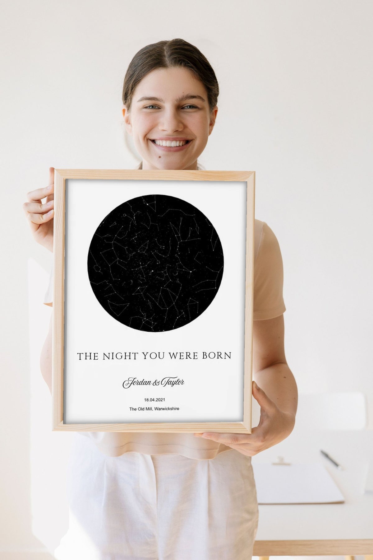 Lifestyle - Personalised The Night You Were Born Star Map Print held by a smiling woman