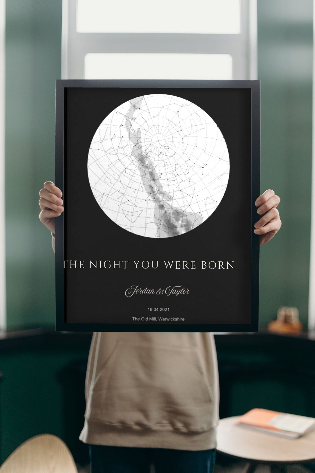 Lifestyle - Personalised The Night You Were Born Star Map Print – Black held up in a bright room
