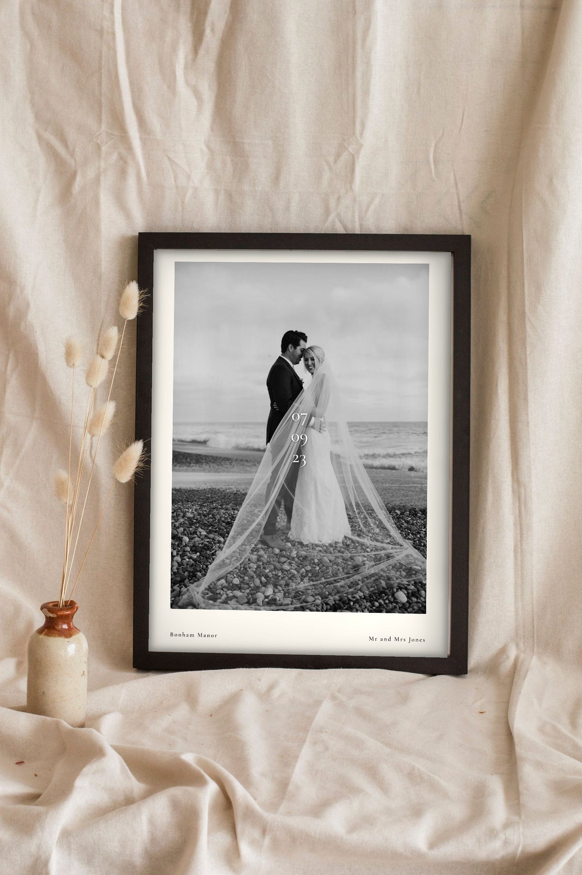 Lifestyle - Personalised Wedding Photo Print With Date leaning in a frame with dried flowers
