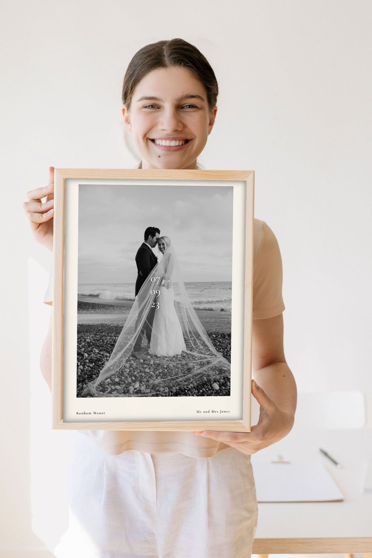 Lifestyle - Personalised Wedding Photo Print With Date held by a smiling woman