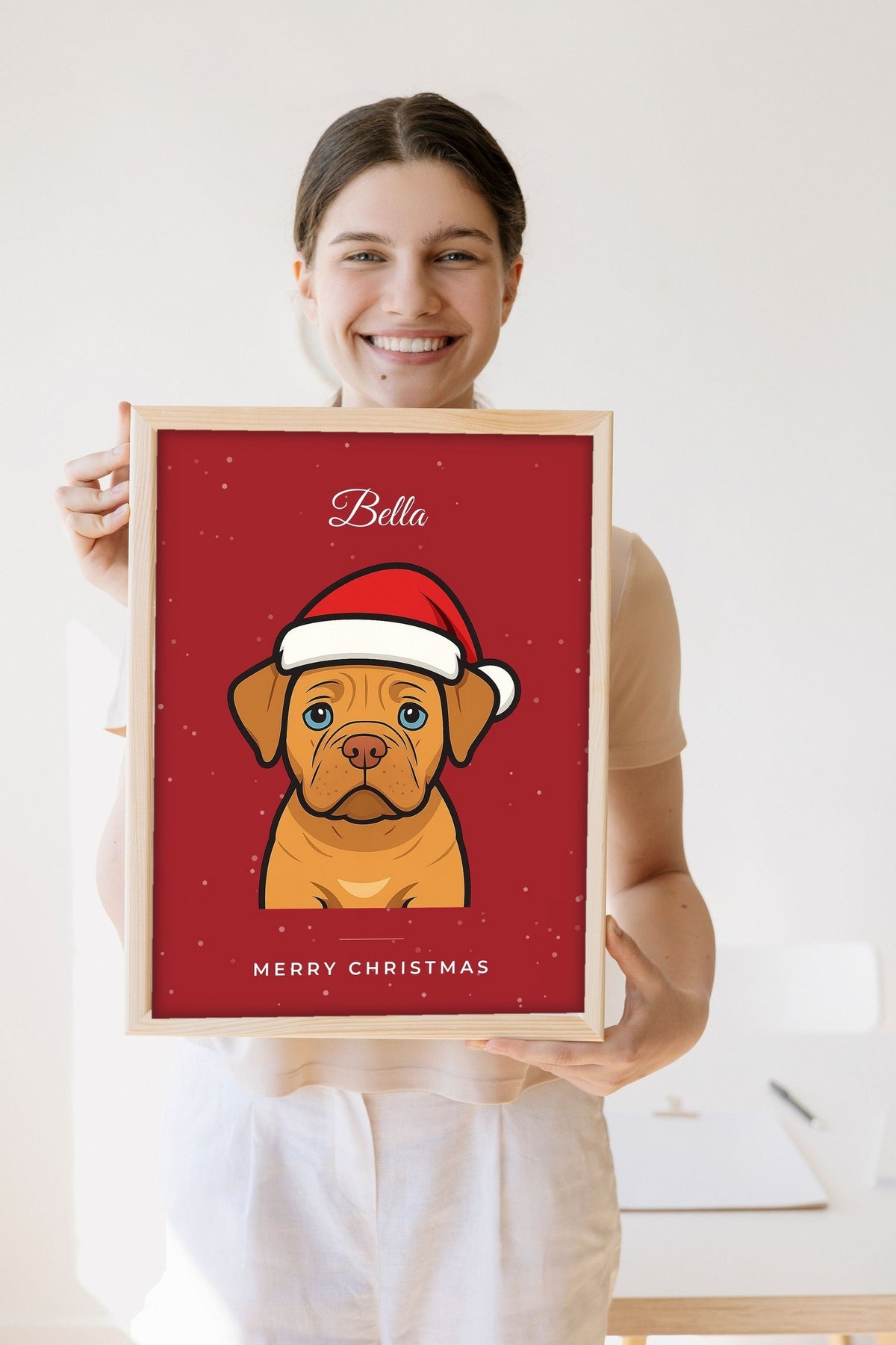 Lifestyle - Personalised Christmas Pet Portrait Print held by a smiling woman