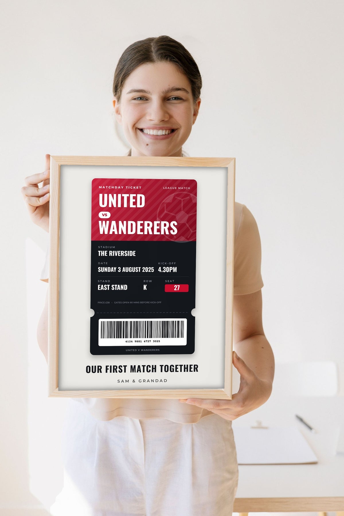 Lifestyle - Personalised Football Match Ticket Print held by a smiling woman
