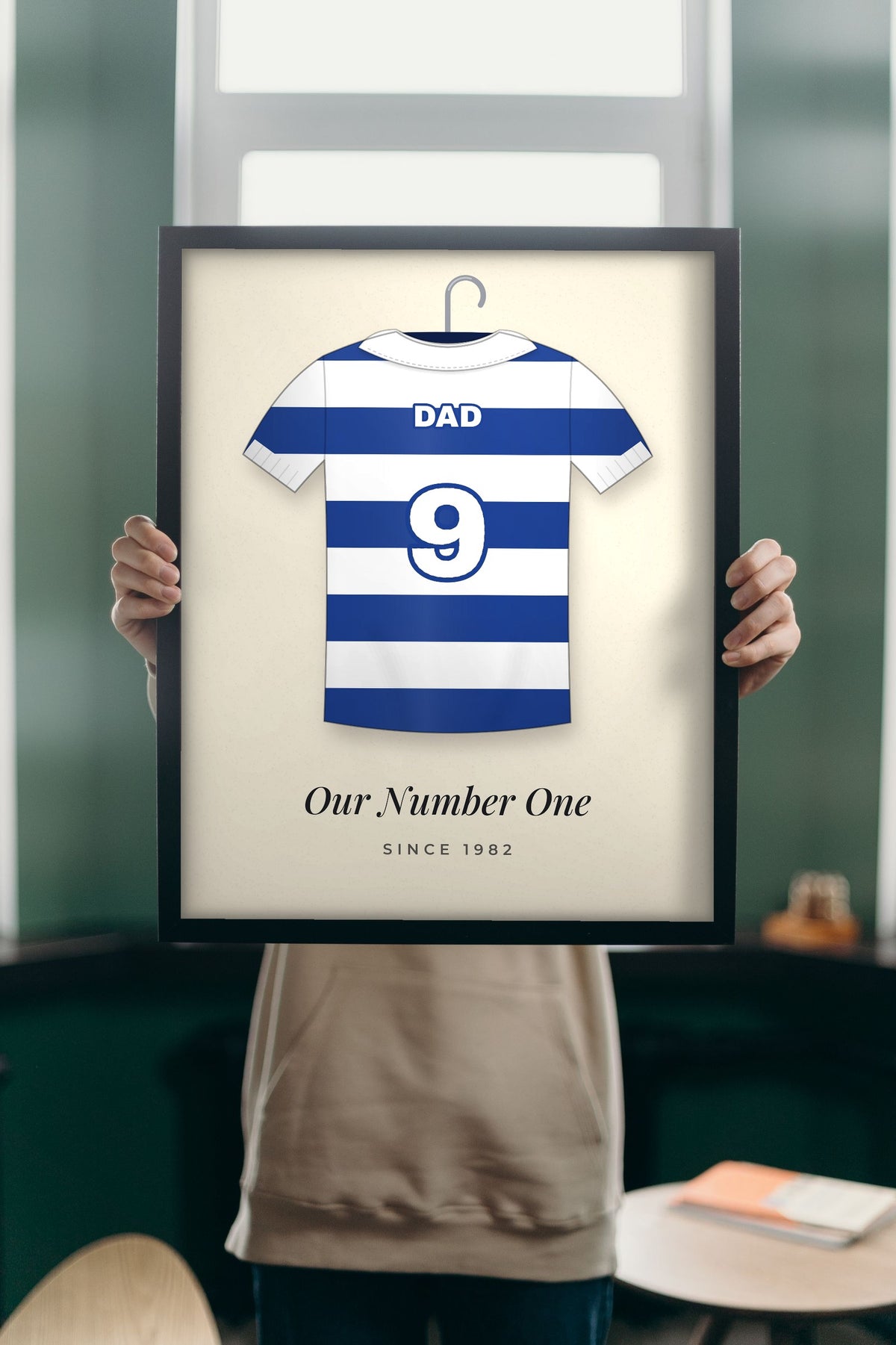 Lifestyle - Personalised Retro Football Shirt Print held up in a bright room