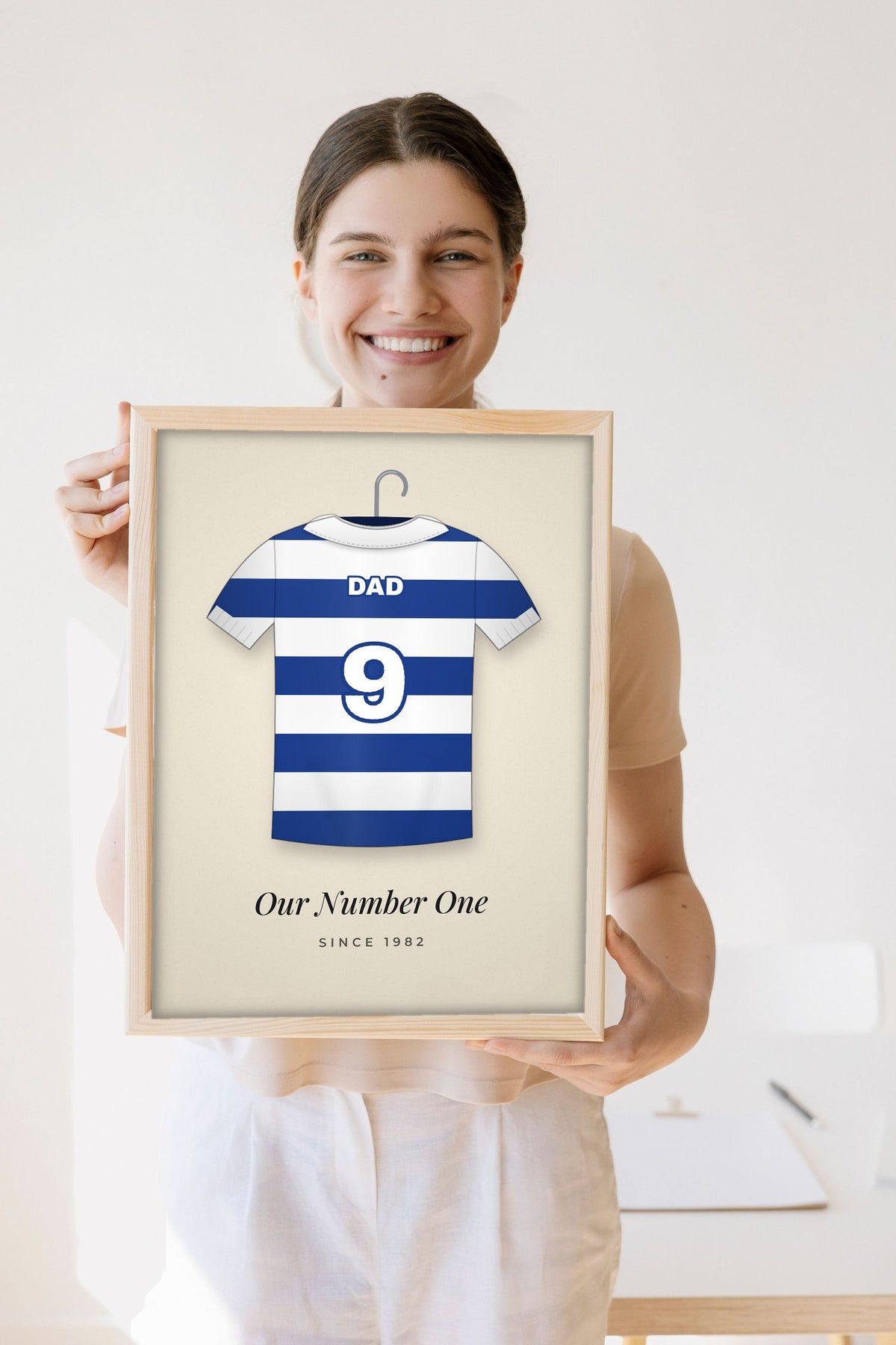 Lifestyle - Personalised Retro Football Shirt Print held by a smiling woman