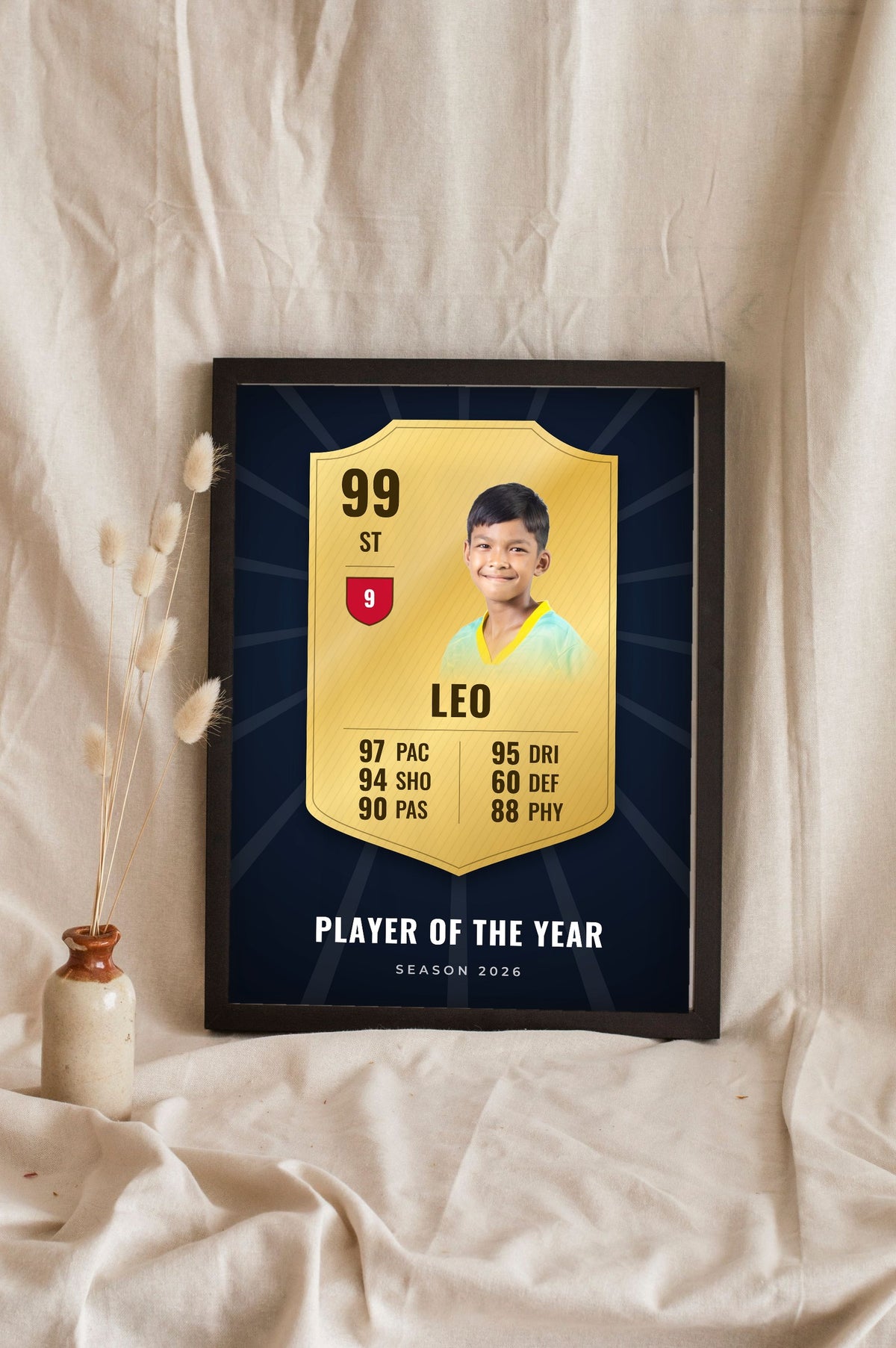 Lifestyle - Personalised Football Player Card Print leaning in a frame with dried flowers