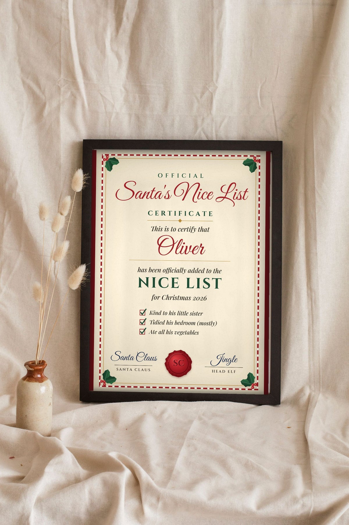 Lifestyle - Personalised Santa's Nice List Certificate Print leaning in a frame with dried flowers