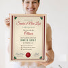Lifestyle - Personalised Santa's Nice List Certificate Print held by a smiling woman
