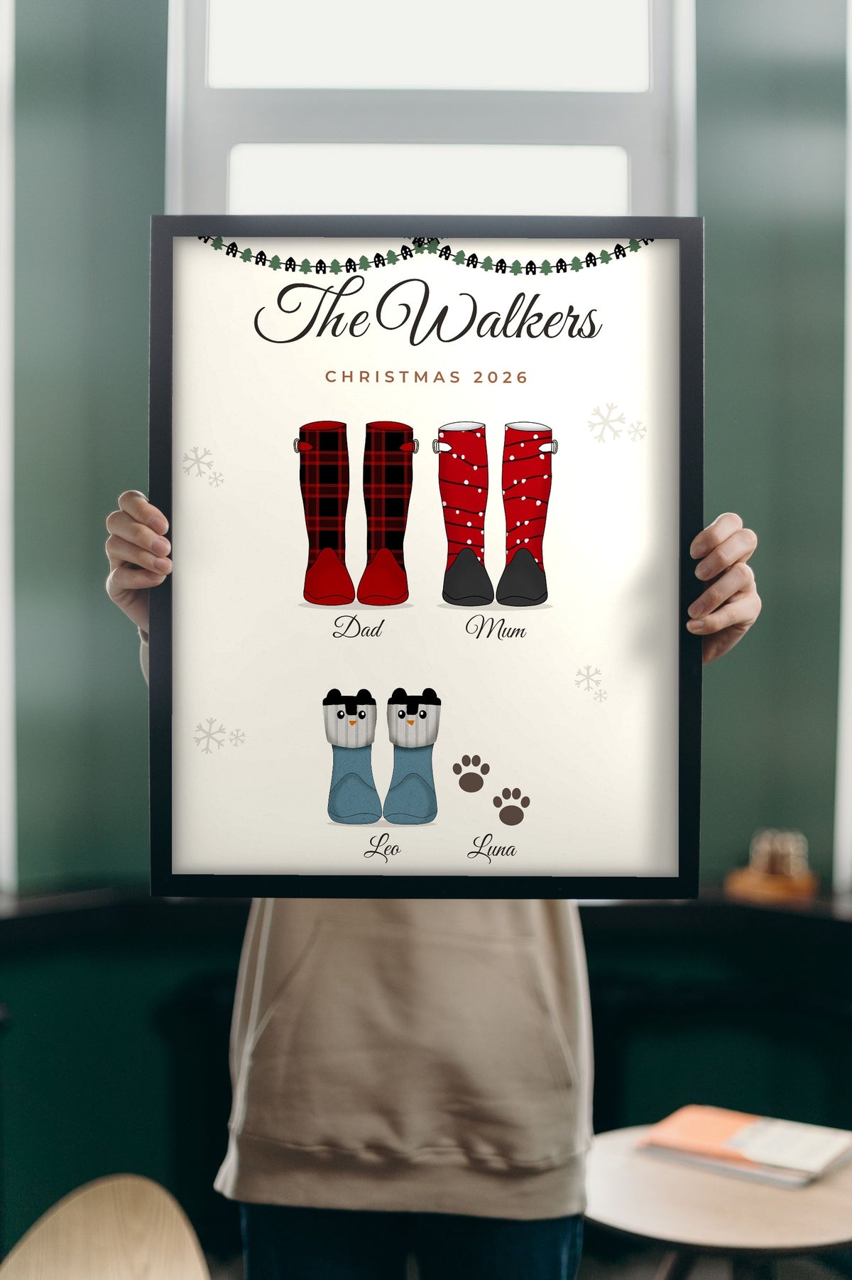 Lifestyle - Personalised Christmas Family Welly Boots Print held up in a bright room