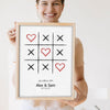 Lifestyle - Personalised Couple Tic Tac Toe Print held by a smiling woman