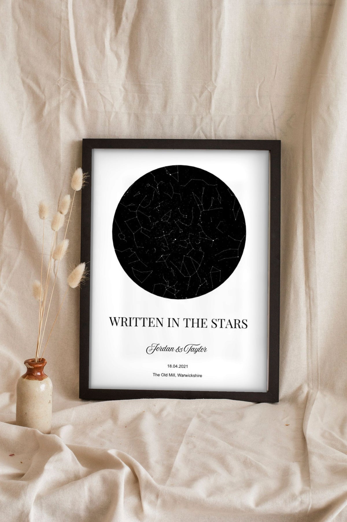 Lifestyle - Personalised Couple Star Map Print leaning in a frame with dried flowers