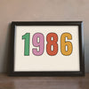 Lifestyle - The Year You Were Born Retro Print leaning on a wooden sideboard
