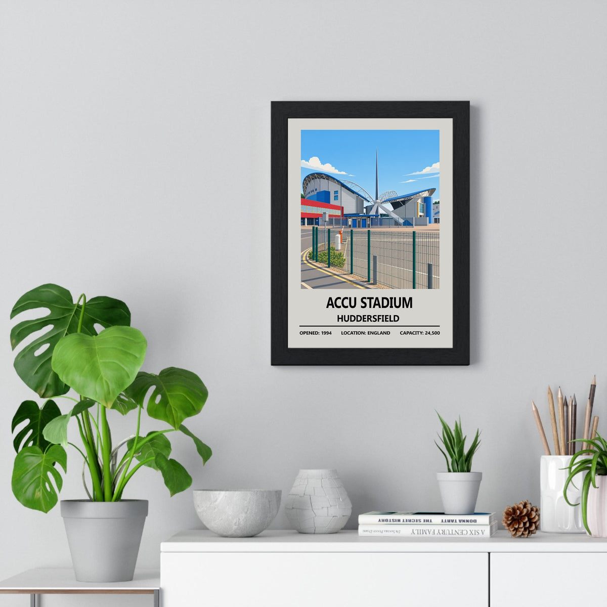 Accu Stadium Huddersfield Town print framed on a living room wall