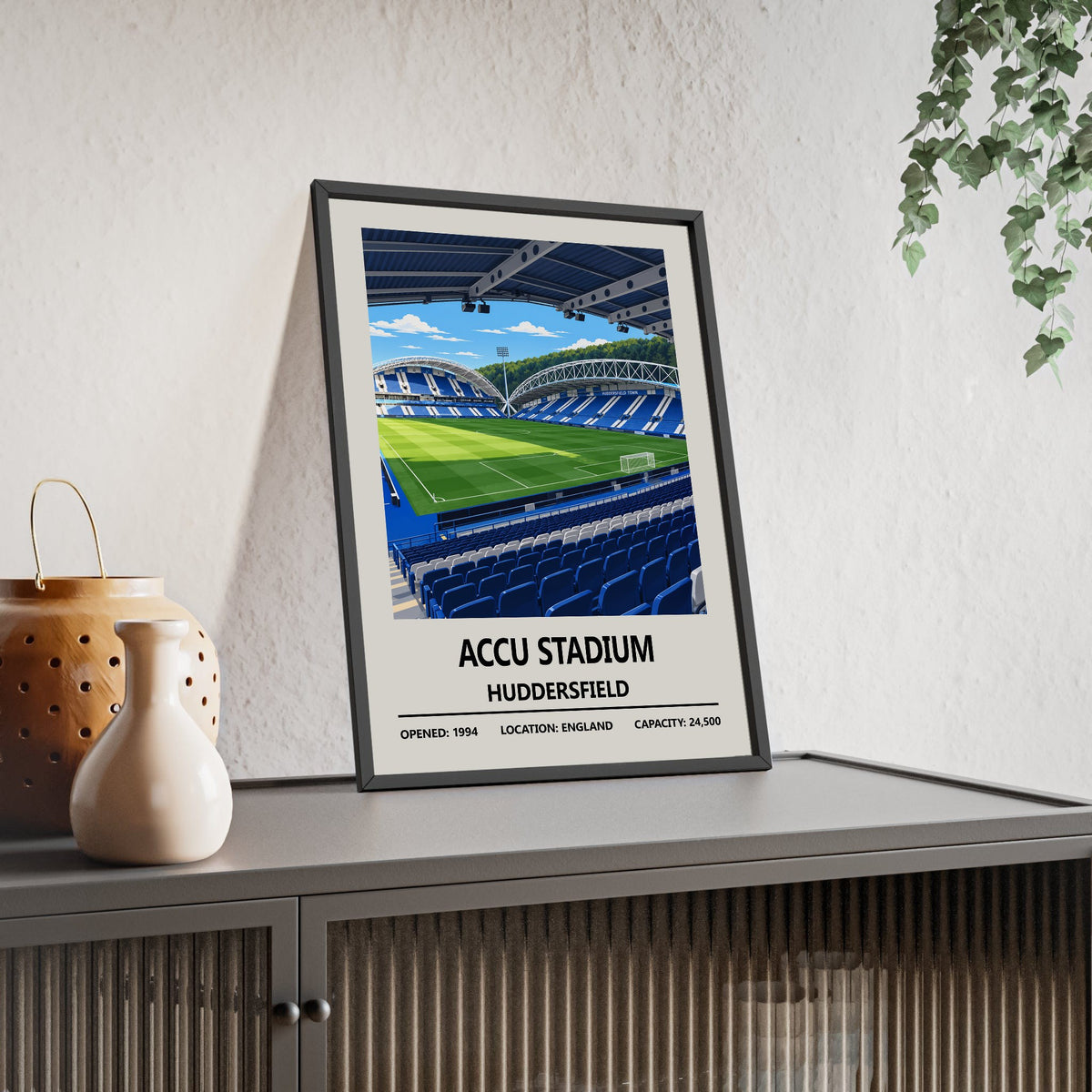 Huddersfield Town Accu Stadium print framed and leaning on a sideboard