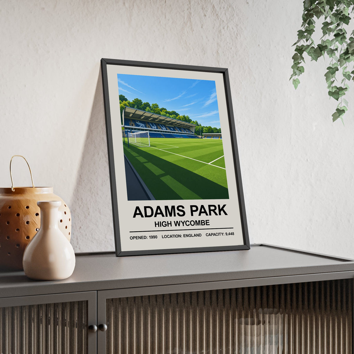 Wycombe Wanderers Adams Park print framed and leaning on a sideboard