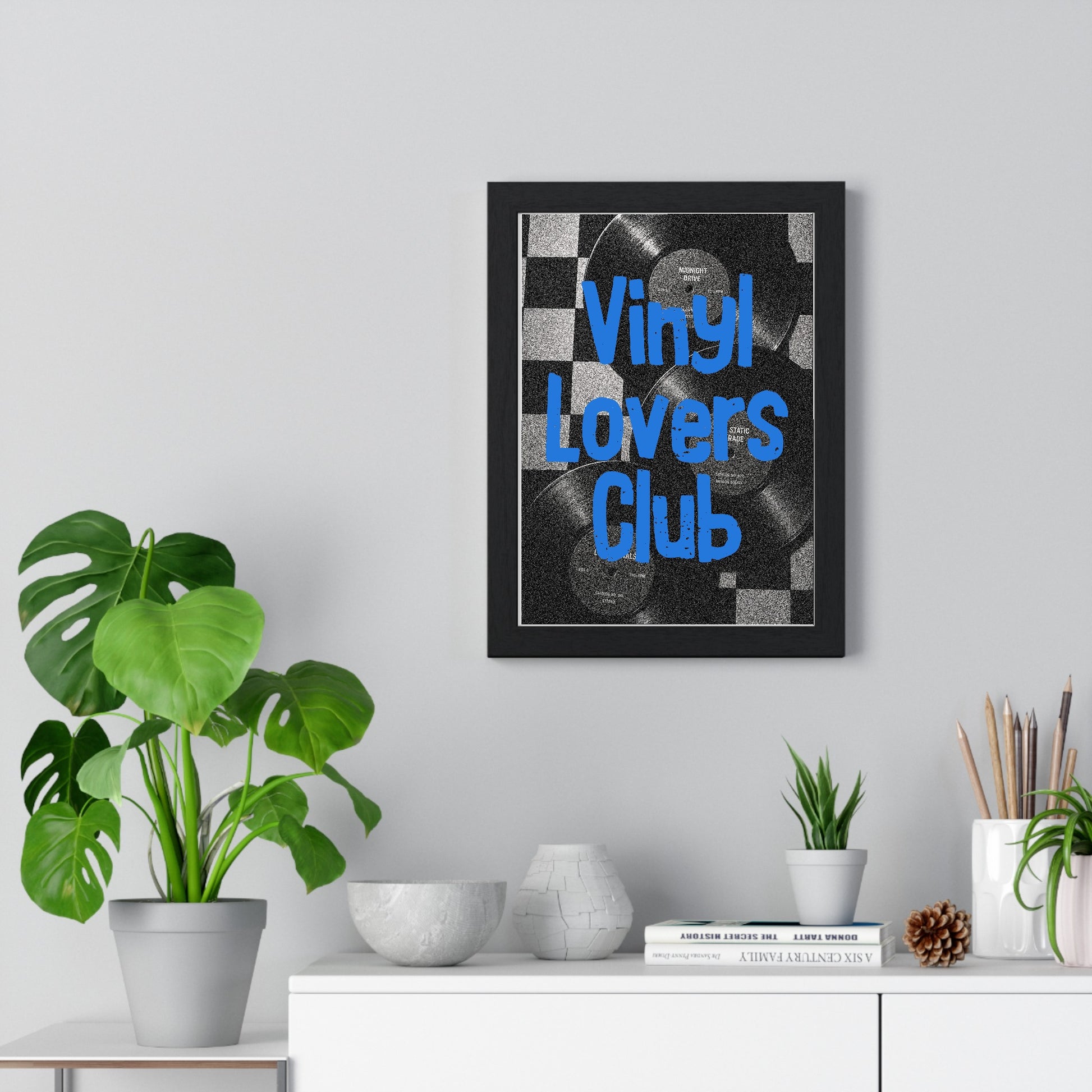 05 Vinyl Records framed poster displayed on living room wall above furniture