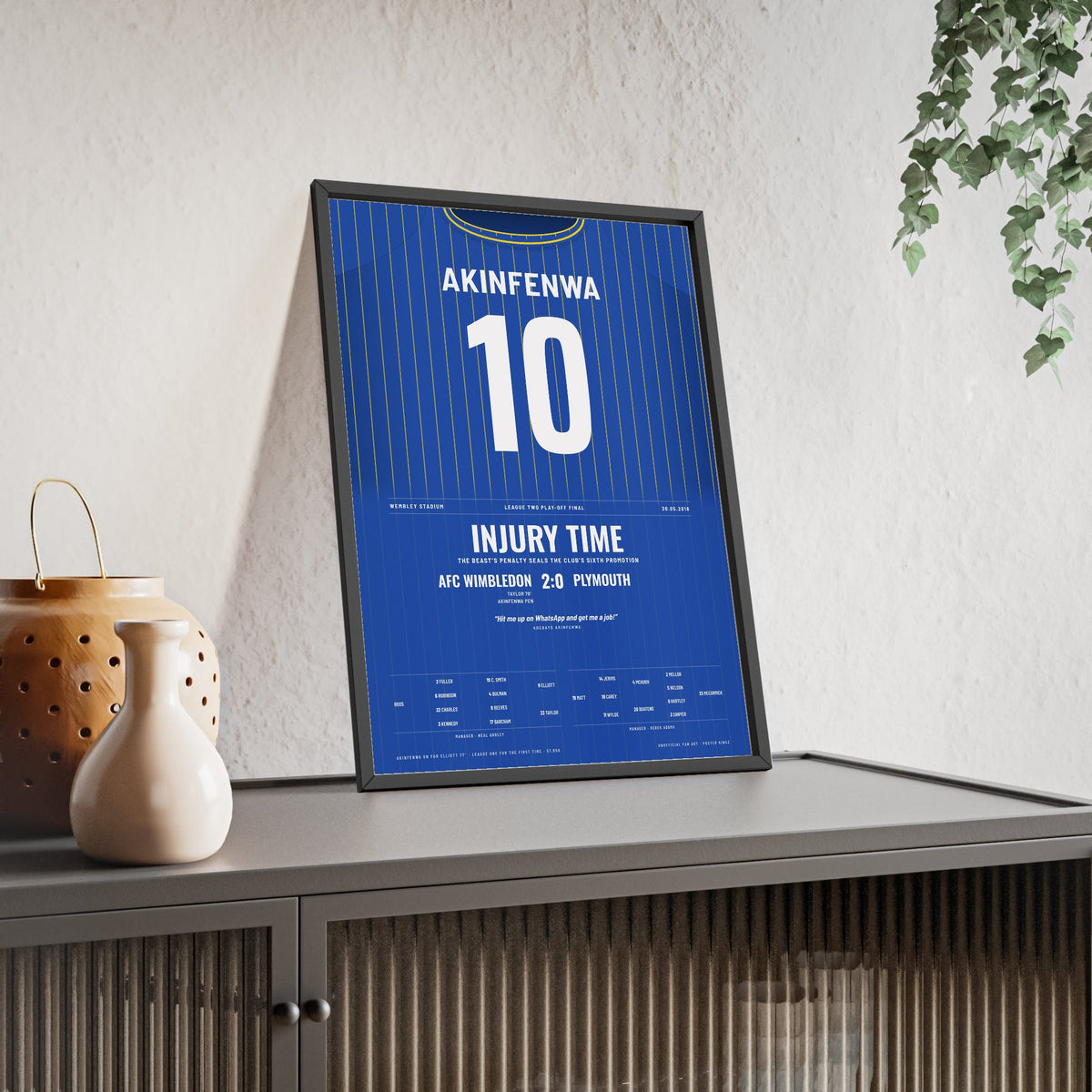 AFC Wimbledon Play-Off Final 2016 Poster - Adebayo Akinfenwa 10 Wembley Shirt Print framed and leaning on a sideboard