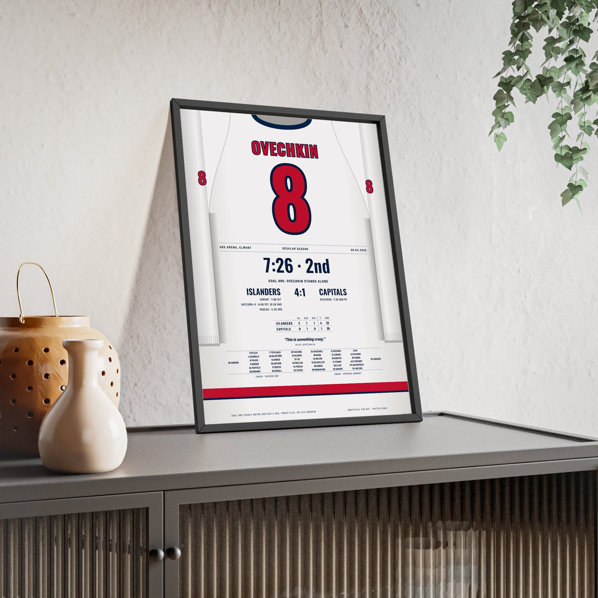 Alex Ovechkin 2025 Goal 895 Record Poster - Washington Capitals 8 Hockey Jersey Print framed and leaning on a sideboard