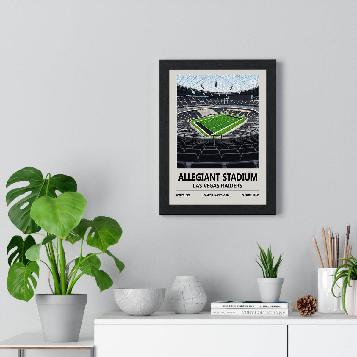 Las Vegas Raiders Allegiant Stadium print framed on a living room wall