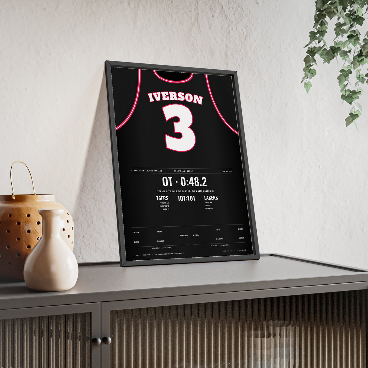 Allen Iverson 2001 NBA Finals Game 1 Poster - Philadelphia 76ers 3 Step-Over Jersey Print framed and leaning on a sideboard