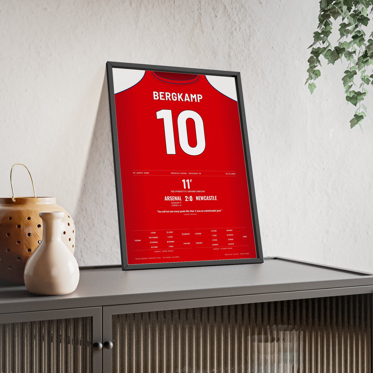 Arsenal Bergkamp Goal 2002 Poster - Bergkamp 10 Pirouette framed and leaning on a sideboard