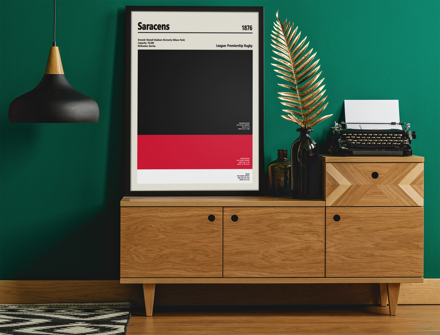 Framed poster on a wooden cabinet against a green wall