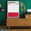 Framed England Rugby Union poster on a wooden sideboard with decorative elements.