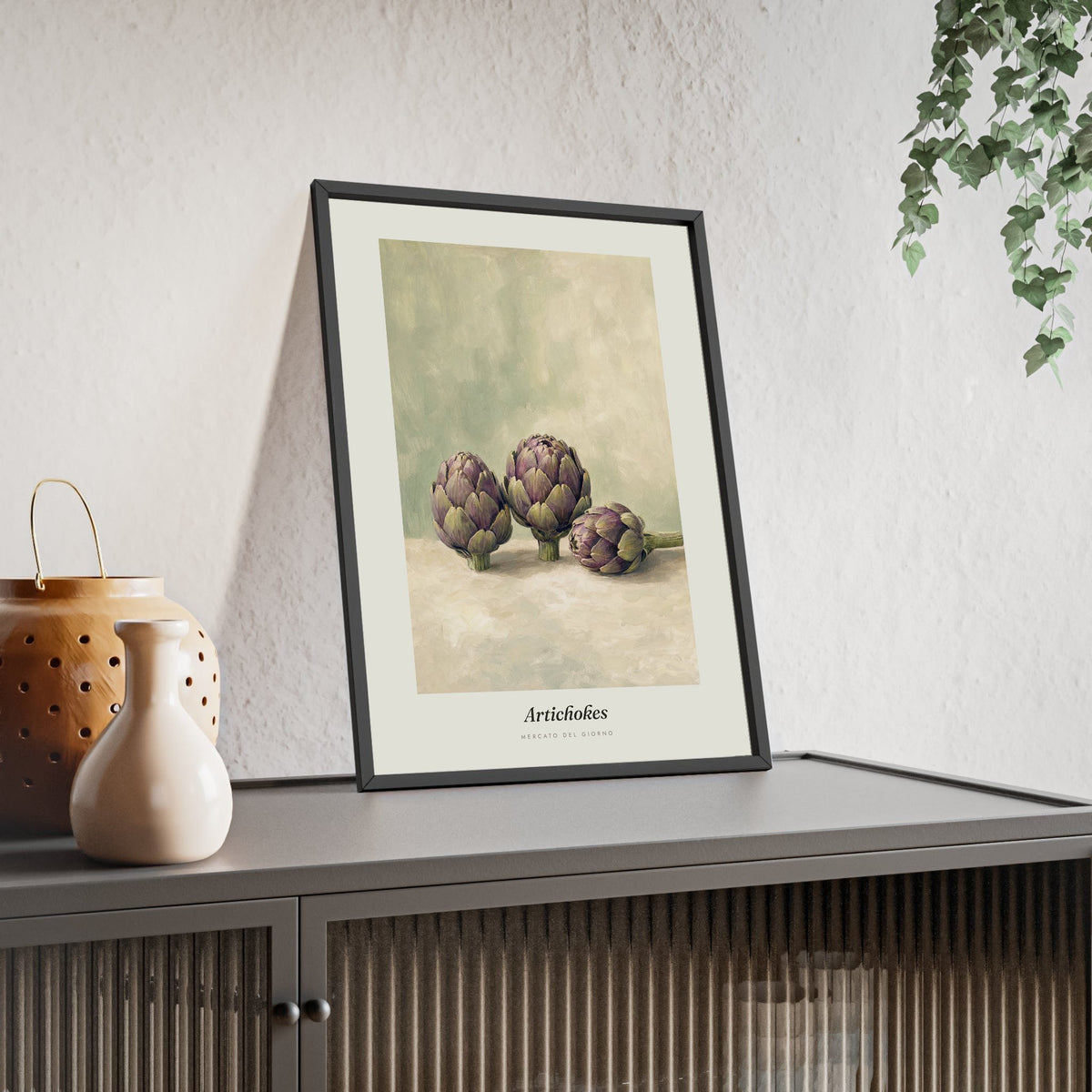 Artichokes Print framed and leaning on a sideboard