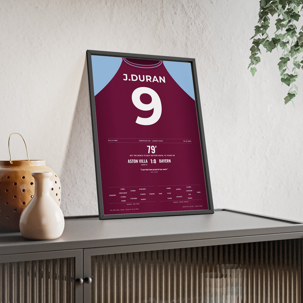Aston Villa 1-0 Bayern Champions League 2024 Poster - Durán 9 Villa Park framed and leaning on a sideboard