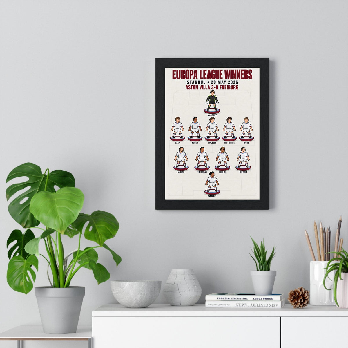 Aston Villa Europa League 2026 XI poster framed on a living room wall