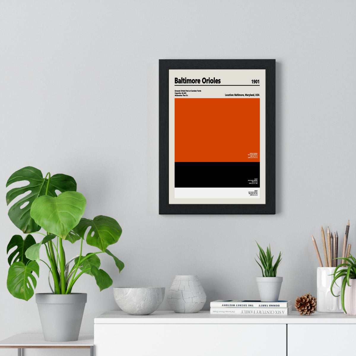 Baltimore Orioles colour swatch print framed on a living room wall