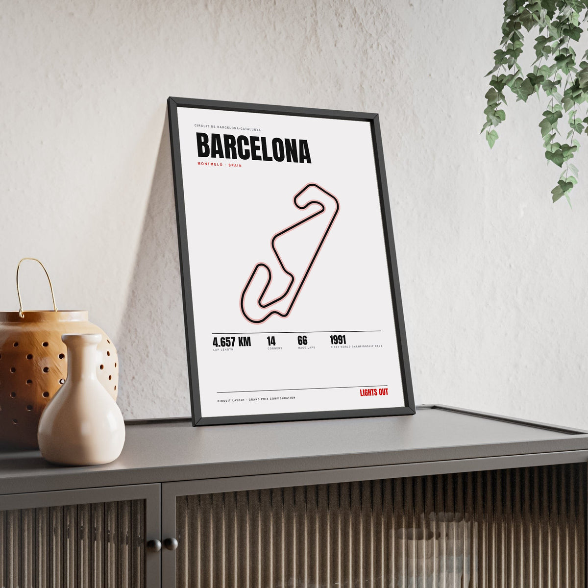 Barcelona Circuit print White framed and leaning on a sideboard