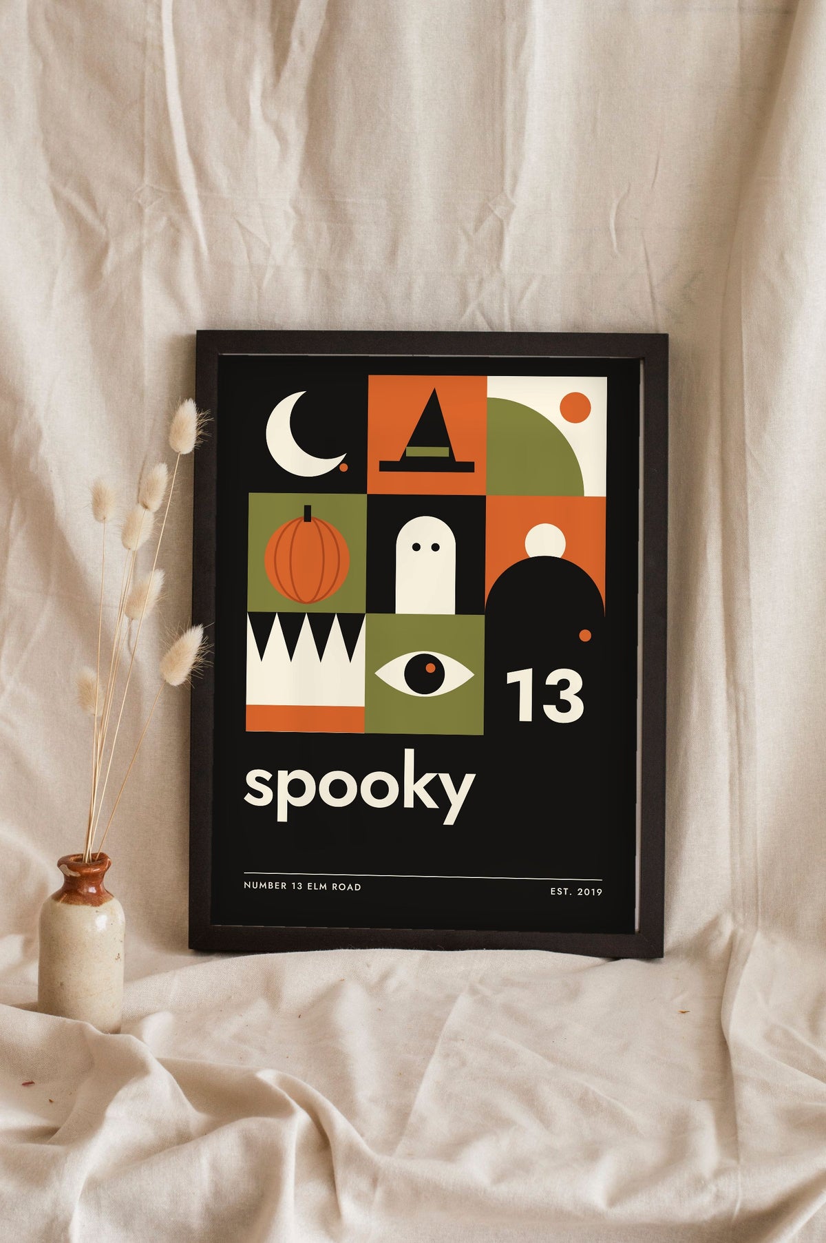 Bauhaus Halloween Print - black spooky version leaning on a shelf