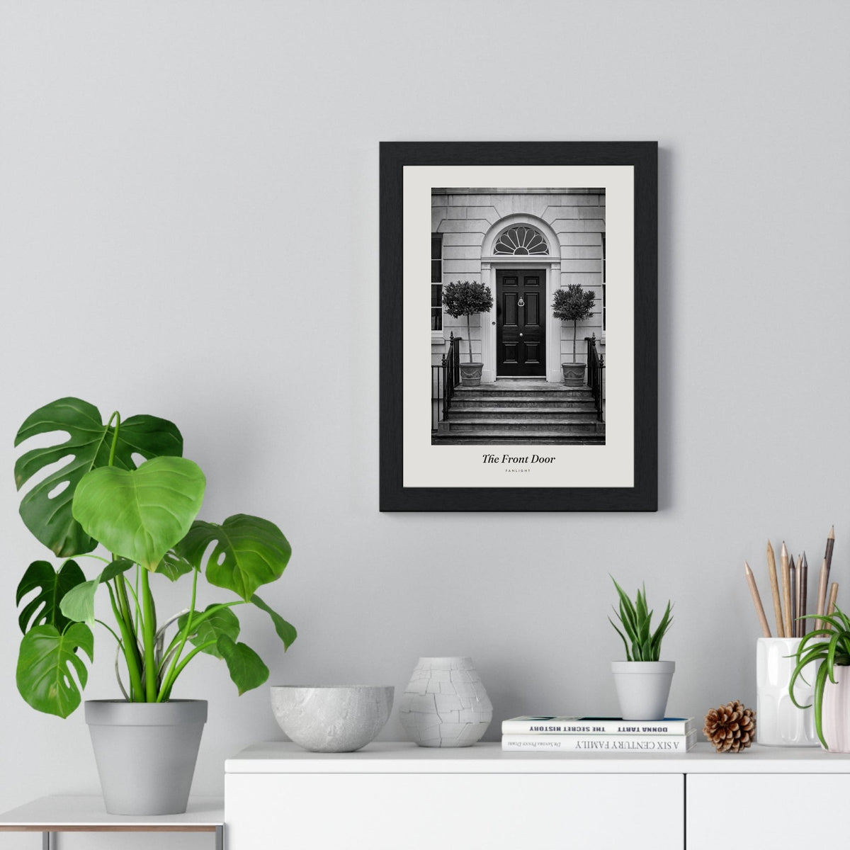 The Front Door Print framed on a living room wall