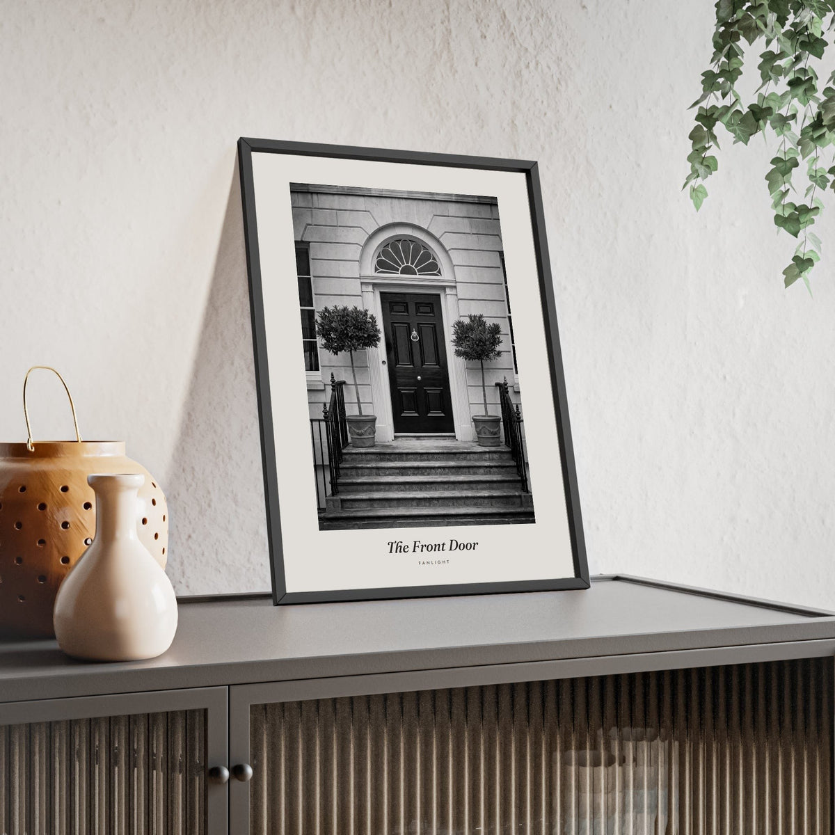 The Front Door Print framed and leaning on a sideboard