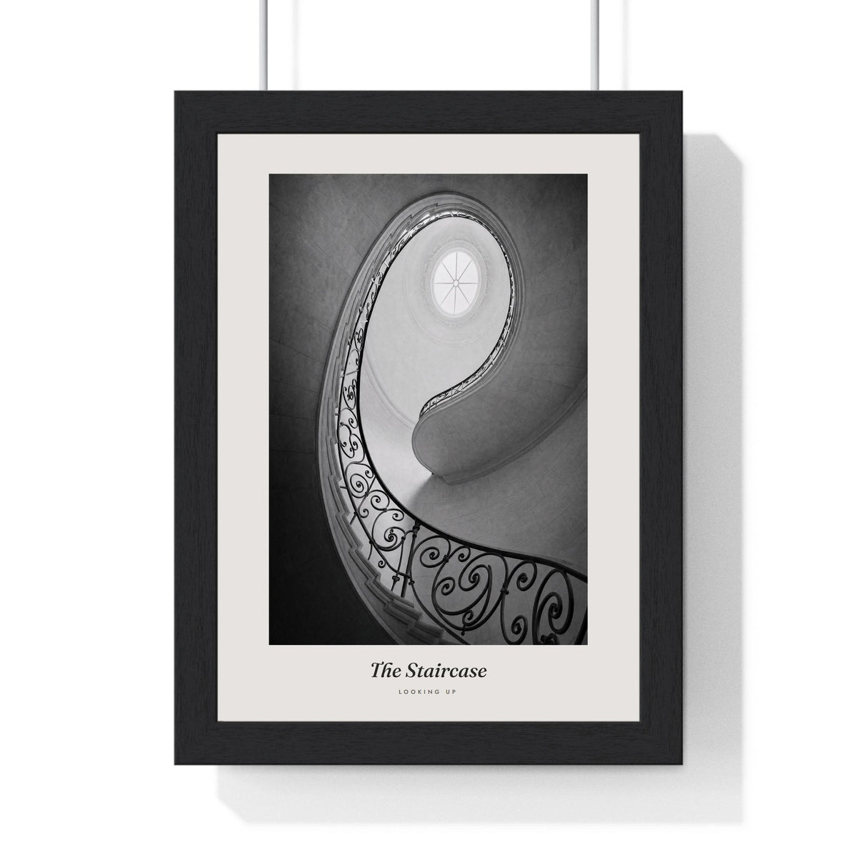 The Staircase Print framed in a black frame, ready to hang