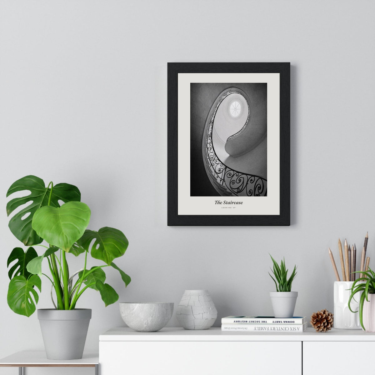 The Staircase Print framed on a living room wall
