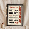 Black Country Sayings Print in a black frame propped up on linen