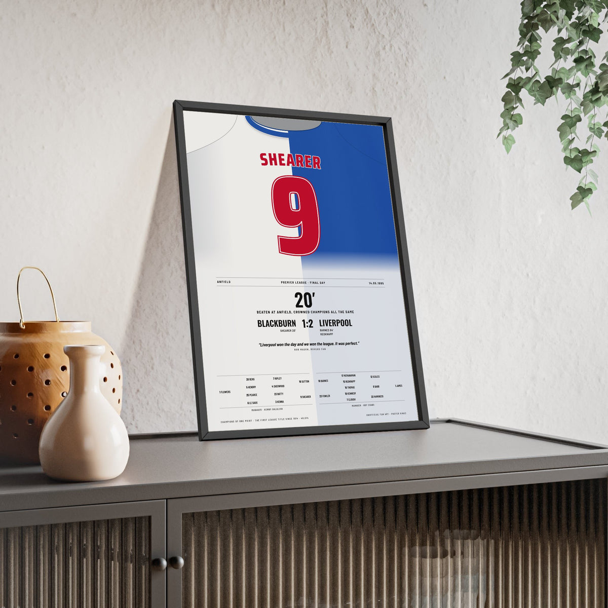Blackburn Rovers Champions 1995 Poster - Alan Shearer 9 Anfield Shirt Print framed and leaning on a sideboard