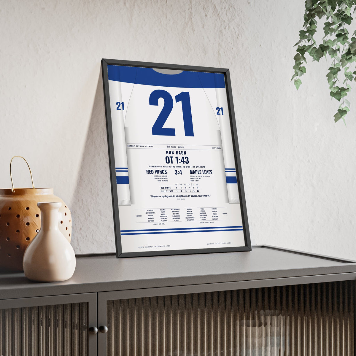 Bob Baun 1964 Cup Final Overtime Winner Poster - Toronto Maple Leafs 21 Hockey Jersey Print framed and leaning on a sideboard