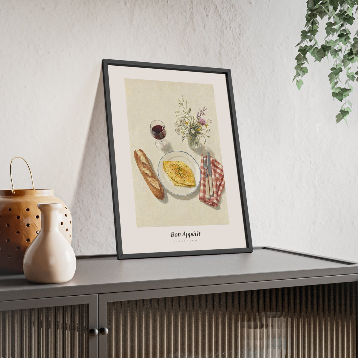 Bon Appétit Print framed and leaning on a sideboard