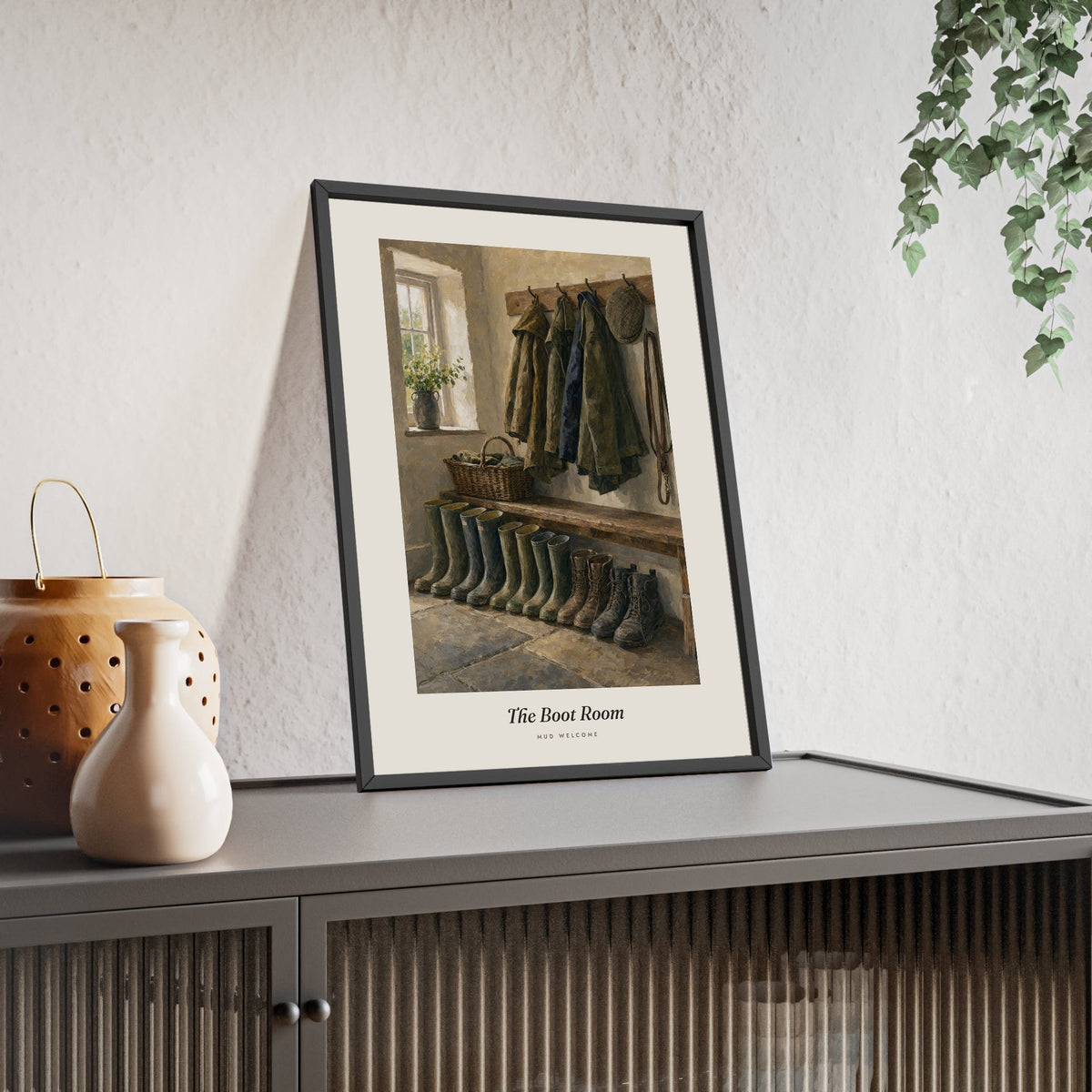 The Boot Room Print framed and leaning on a sideboard