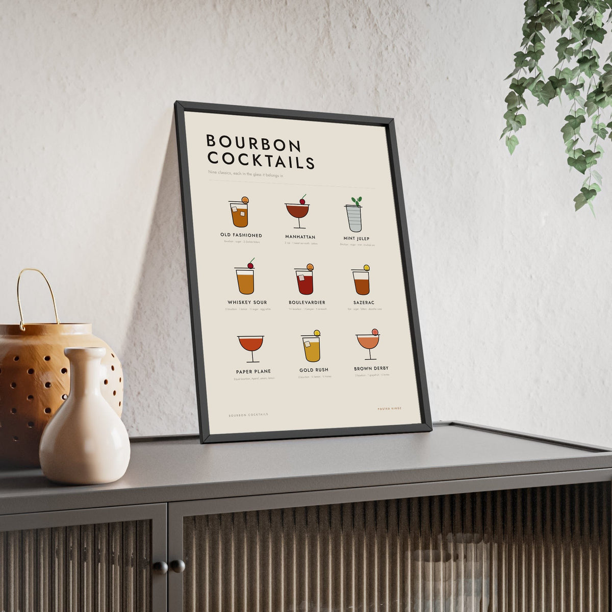 Bourbon Cocktails print framed and leaning on a sideboard