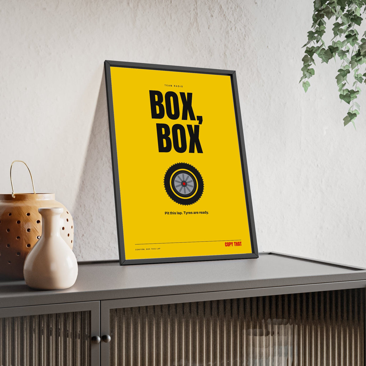 Box Box Racing print framed and leaning on a sideboard