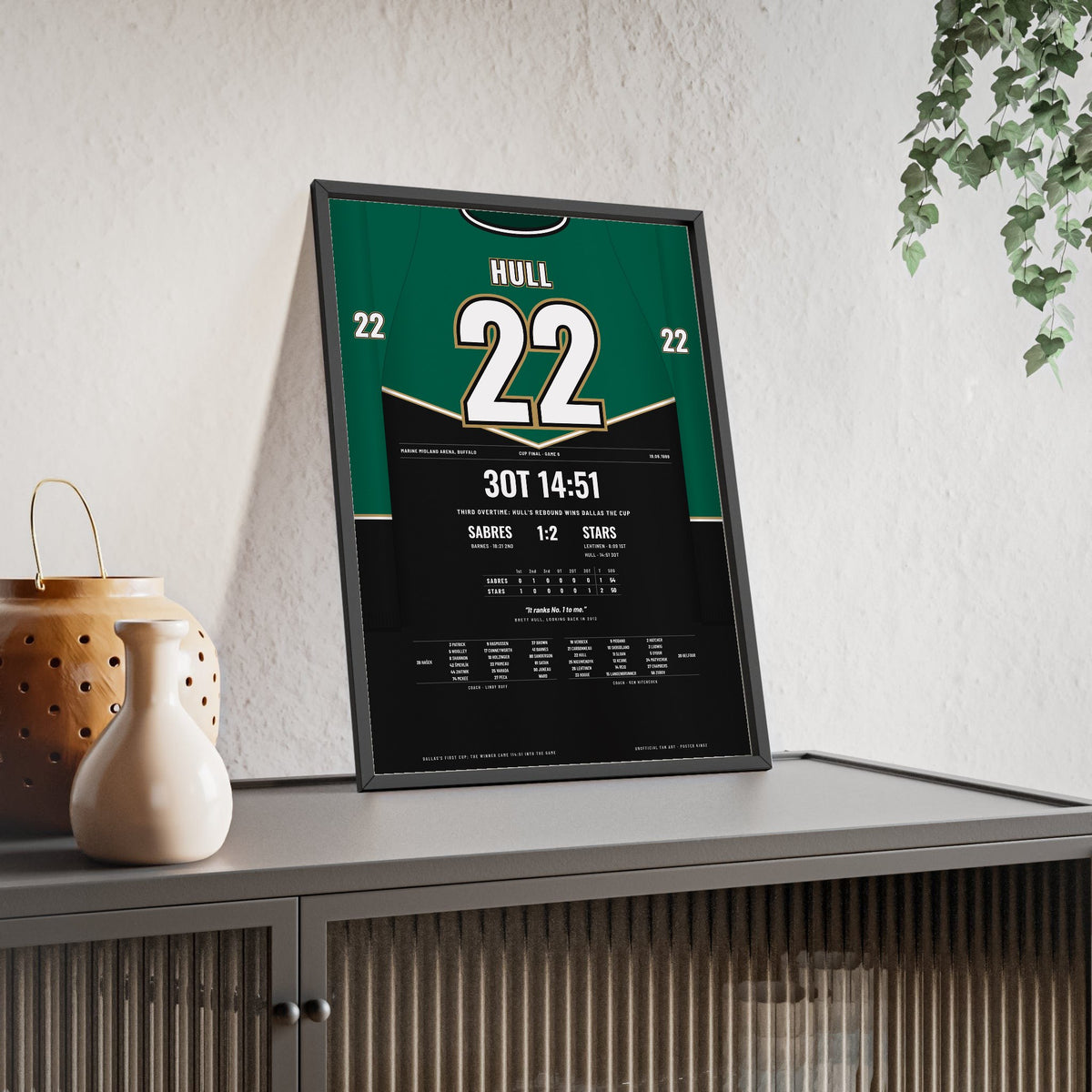 Brett Hull 1999 Cup Final Triple Overtime Winner Poster - Dallas Stars 22 Hockey Jersey Print framed and leaning on a sideboard