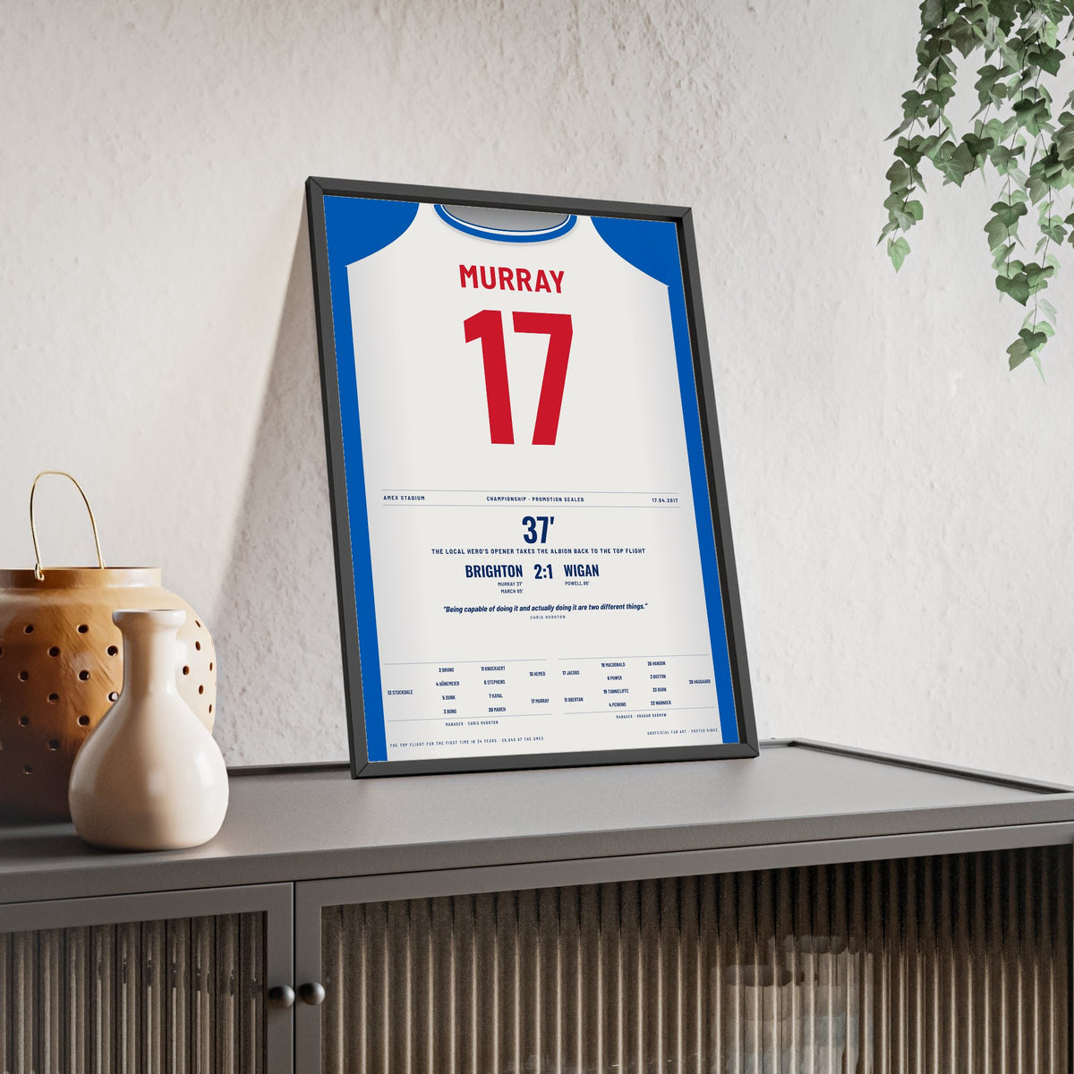 Brighton Promotion 2017 Poster - Glenn Murray 17 Amex Shirt Print framed and leaning on a sideboard