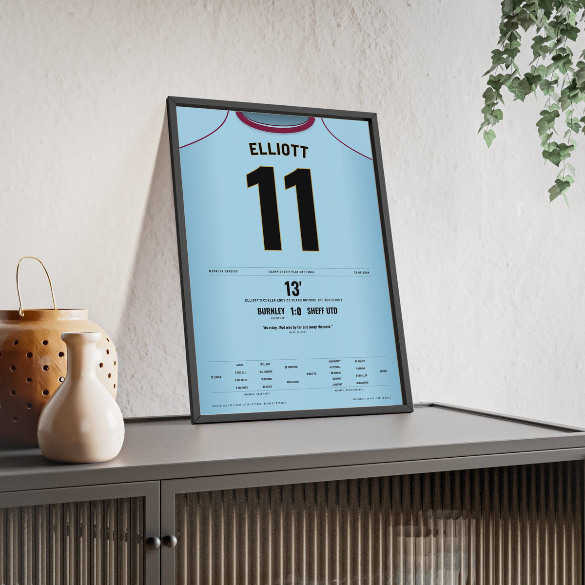Burnley Play-Off Final 2009 Poster - Wade Elliott 11 Wembley Shirt Print framed and leaning on a sideboard