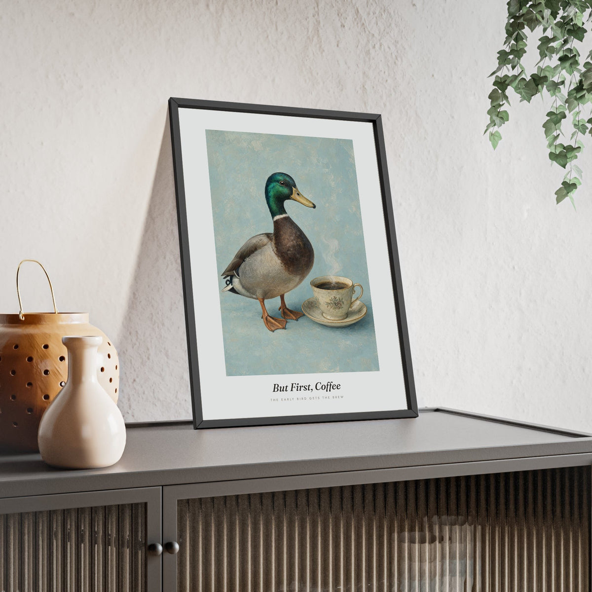 But First Coffee Duck Print framed and leaning on a sideboard