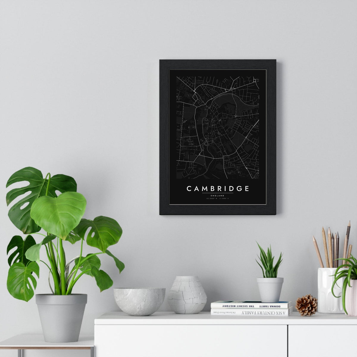 Cambridge street map poster in black, minimal city map print framed on a living room wall