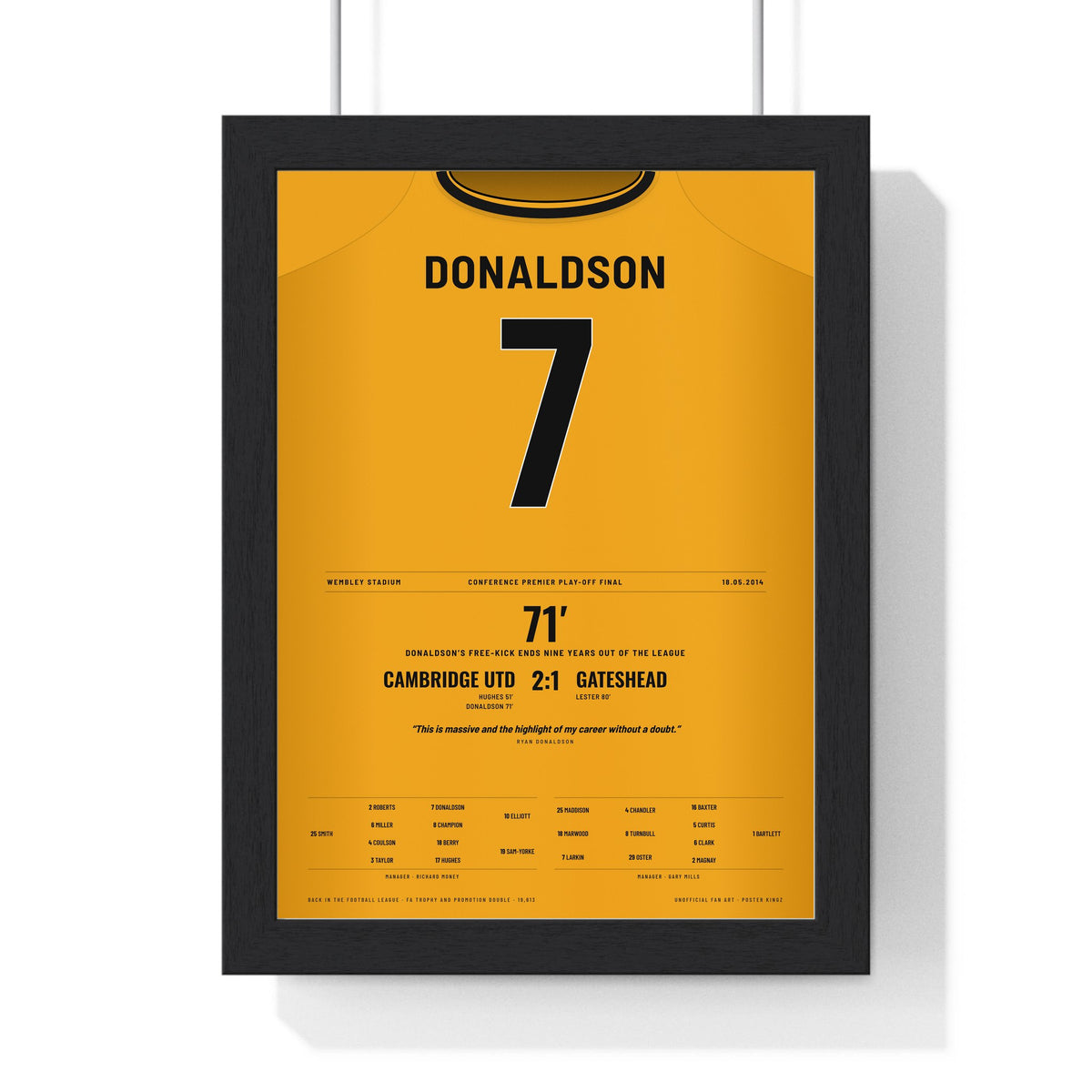 Cambridge United Play-Off Final 2014 Poster - Ryan Donaldson 7 Wembley Shirt Print framed in a black frame, ready to hang